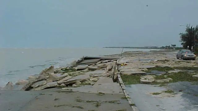 Damaged concrete seawall after a coastal storm in Florida