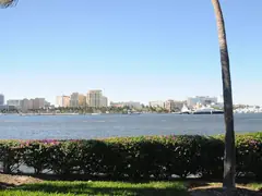 Seawall-lined waterfront on the Lake Worth Lagoon with palm trees
