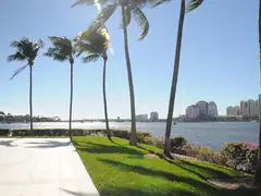 Waterfront walkway and palms beside the Intracoastal Waterway