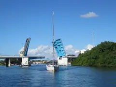 Sailboat passing the Parker Bridge on the Intracoastal in North Palm Beach